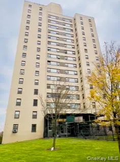 a view of a large building with a yard