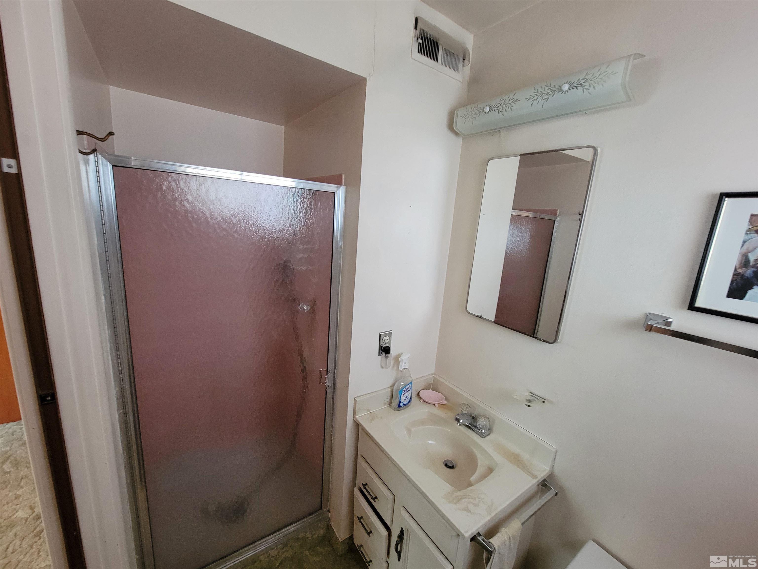 1985 Gridley Avenue Reno, NV 89503 - Photo 11 of 29 a bathroom with a sink vanity and mirror
