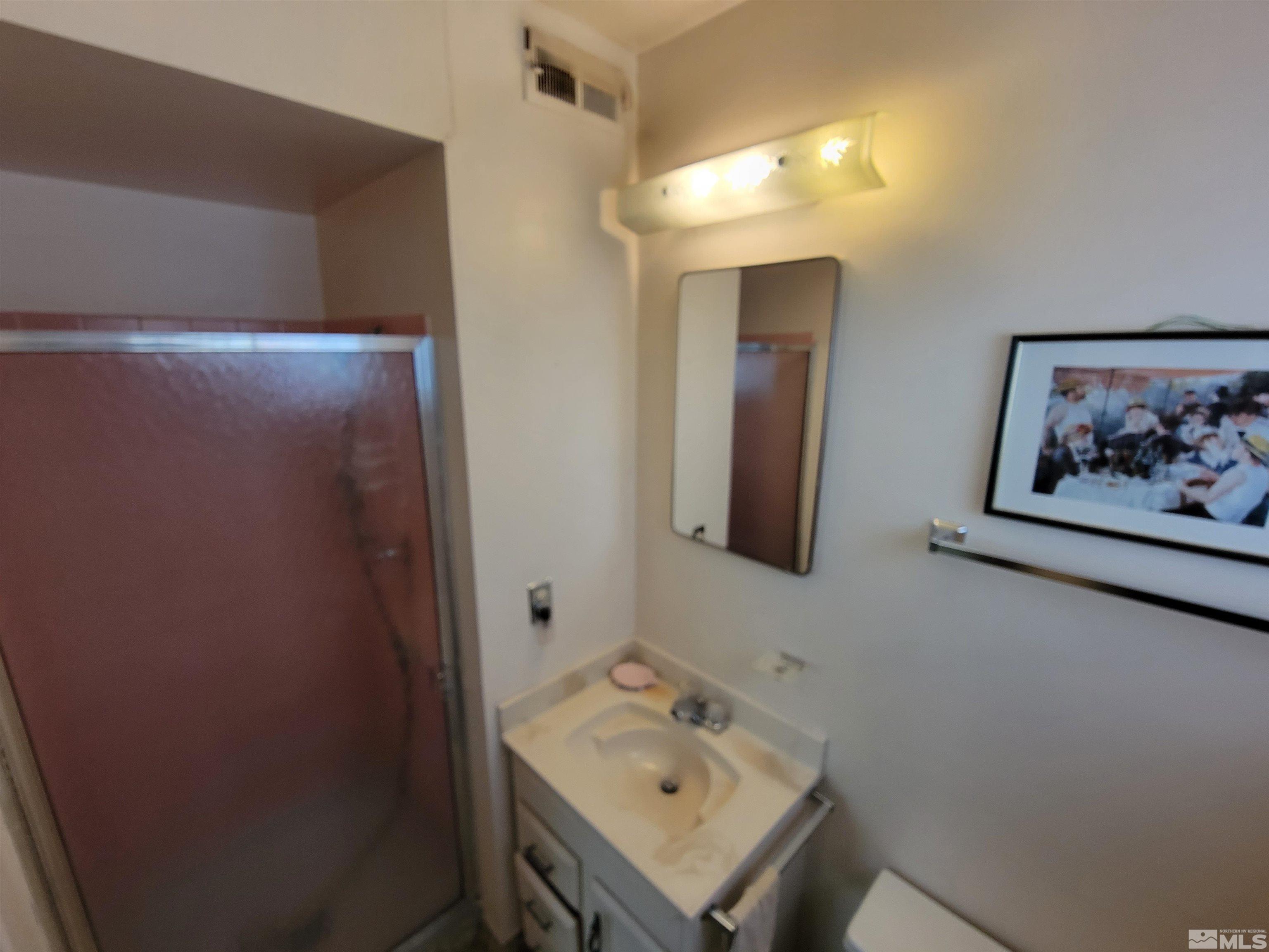 1985 Gridley Avenue Reno, NV 89503 - Photo 12 of 29 a bathroom with a sink and a mirror