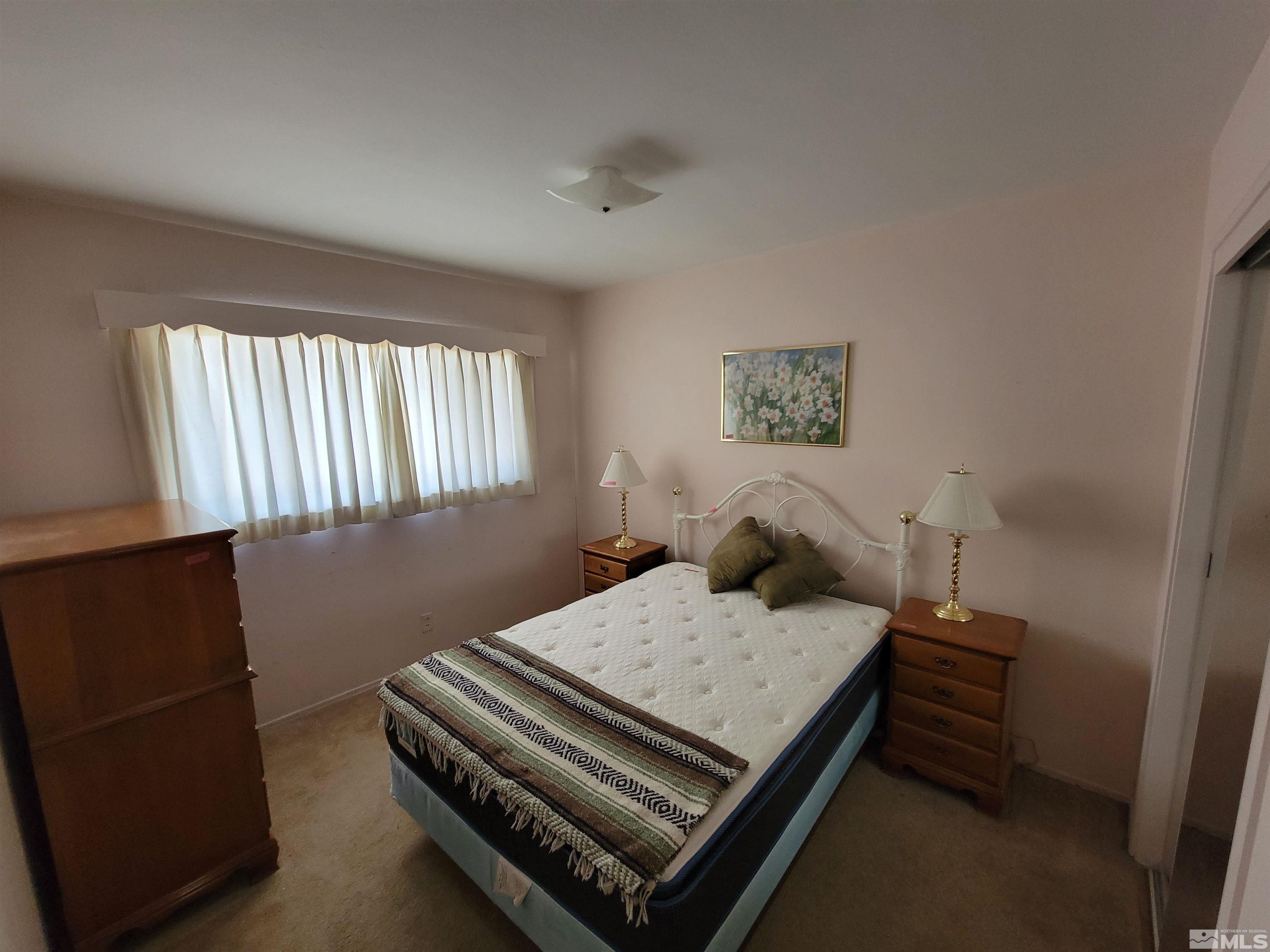 1985 Gridley Avenue Reno, NV 89503 - Photo 14 of 29 a bedroom with a bed and a dresser in it