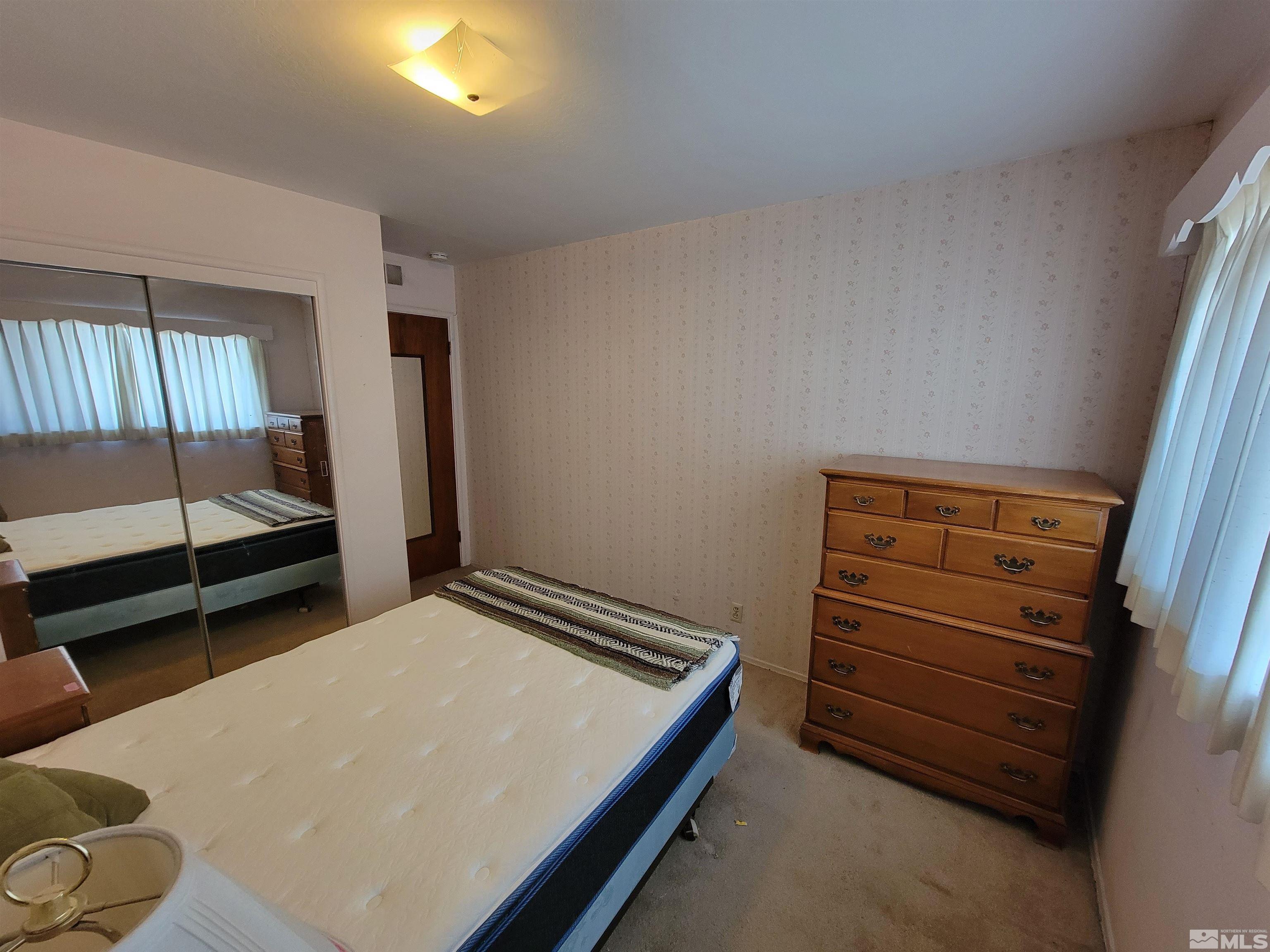 1985 Gridley Avenue Reno, NV 89503 - Photo 15 of 29 a bedroom with a bed and a window