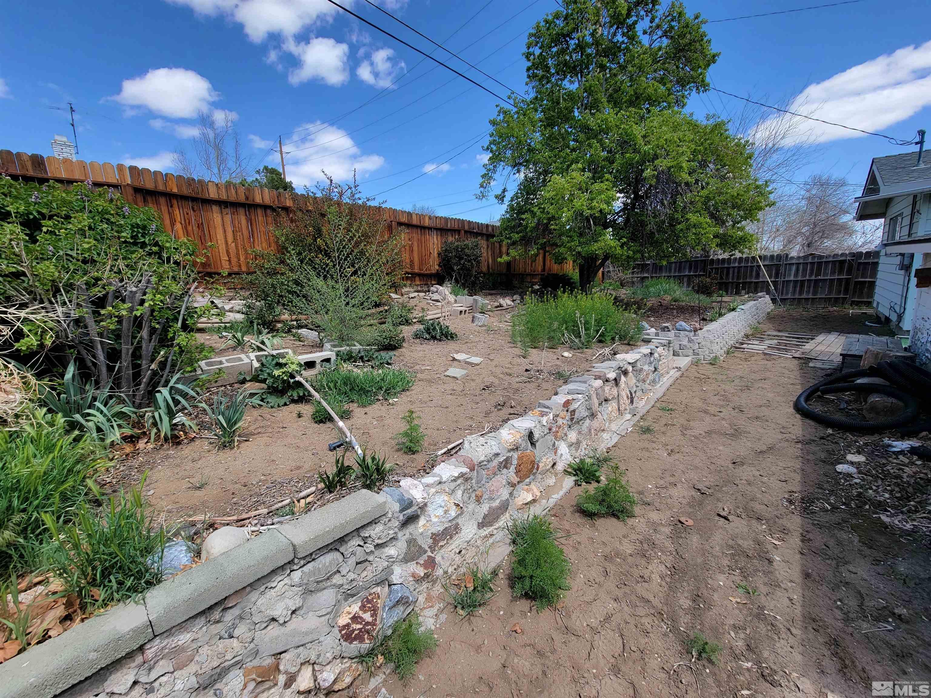 1985 Gridley Avenue Reno, NV 89503 - Photo 29 of 29 a view of a backyard with plants and a patio