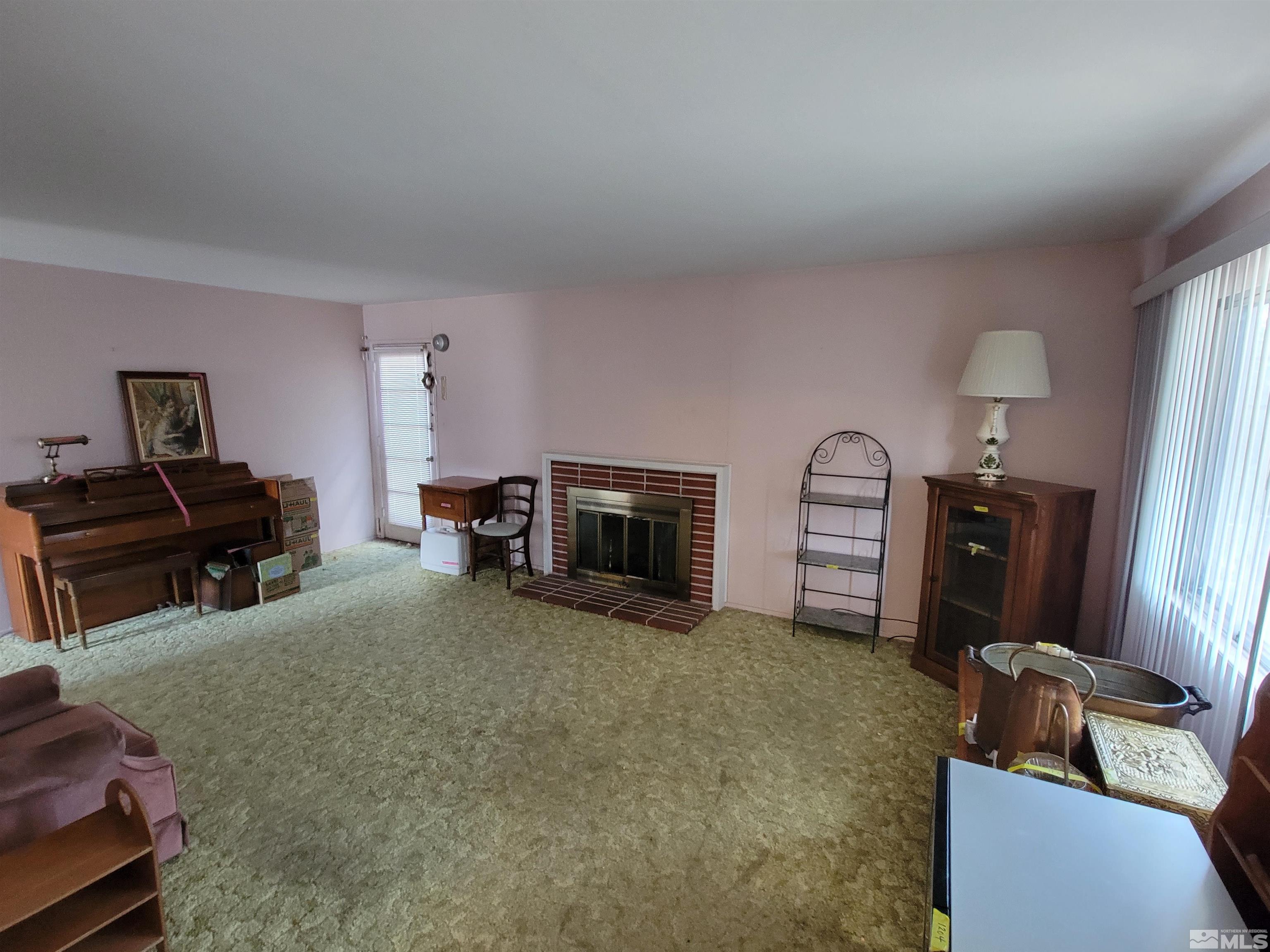 1985 Gridley Avenue Reno, NV 89503 - Photo 4 of 29 a living room with furniture and a flat screen tv