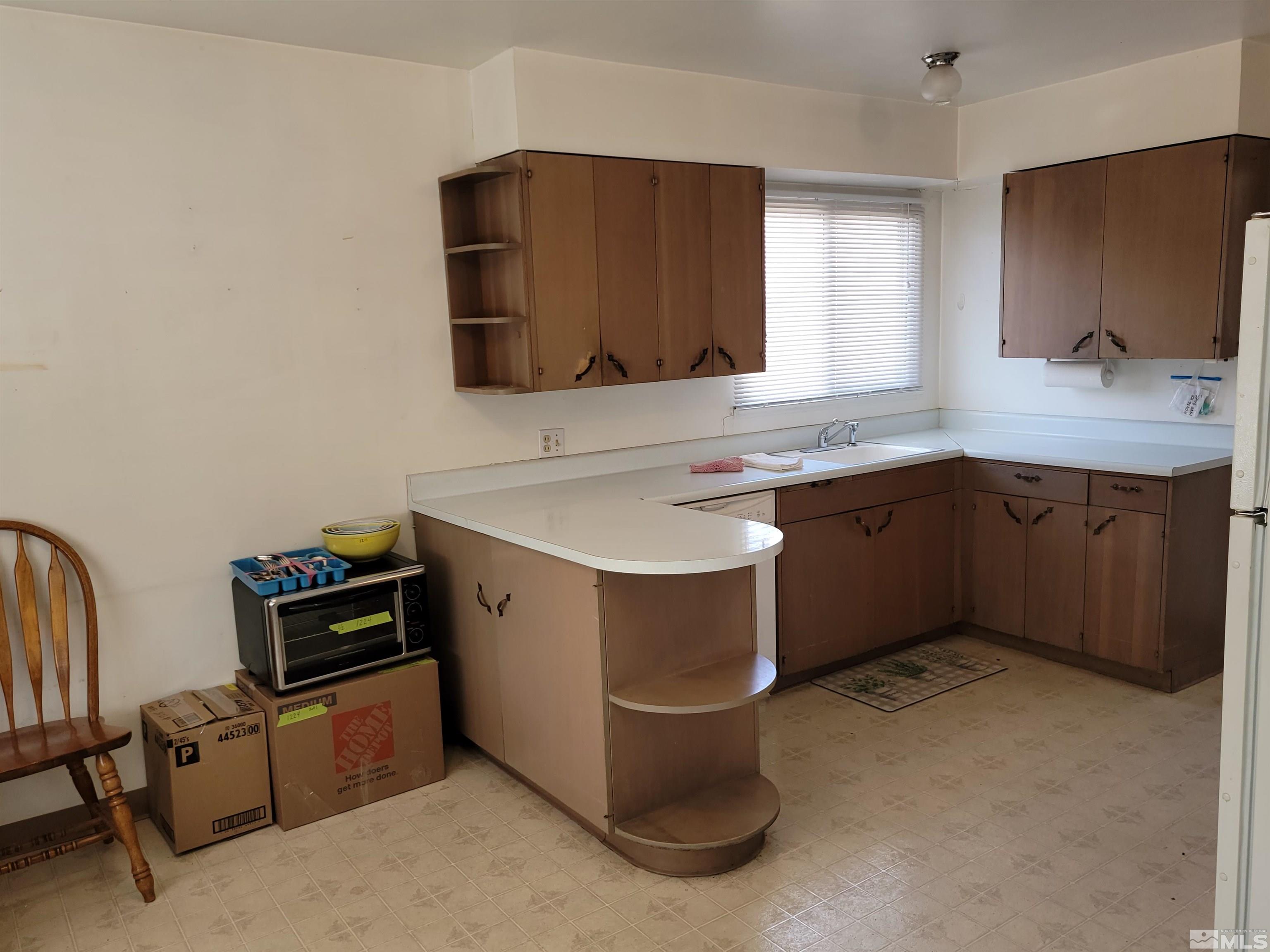 1985 Gridley Avenue Reno, NV 89503 - Photo 7 of 29 a kitchen that has a sink and a stove in it