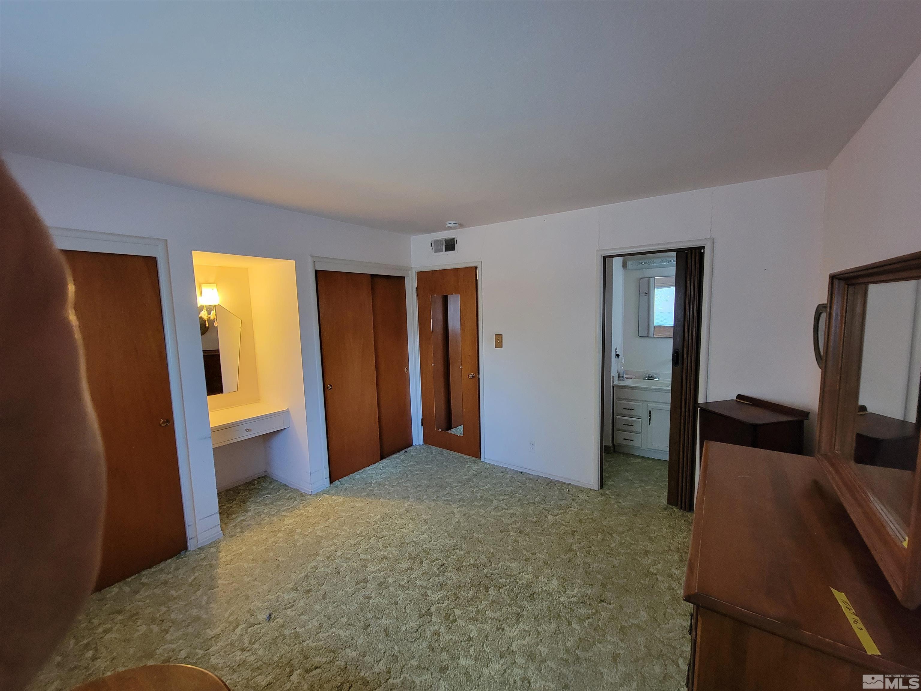 1985 Gridley Avenue Reno, NV 89503 - Photo 10 of 29 a bedroom with a bed and a bathroom