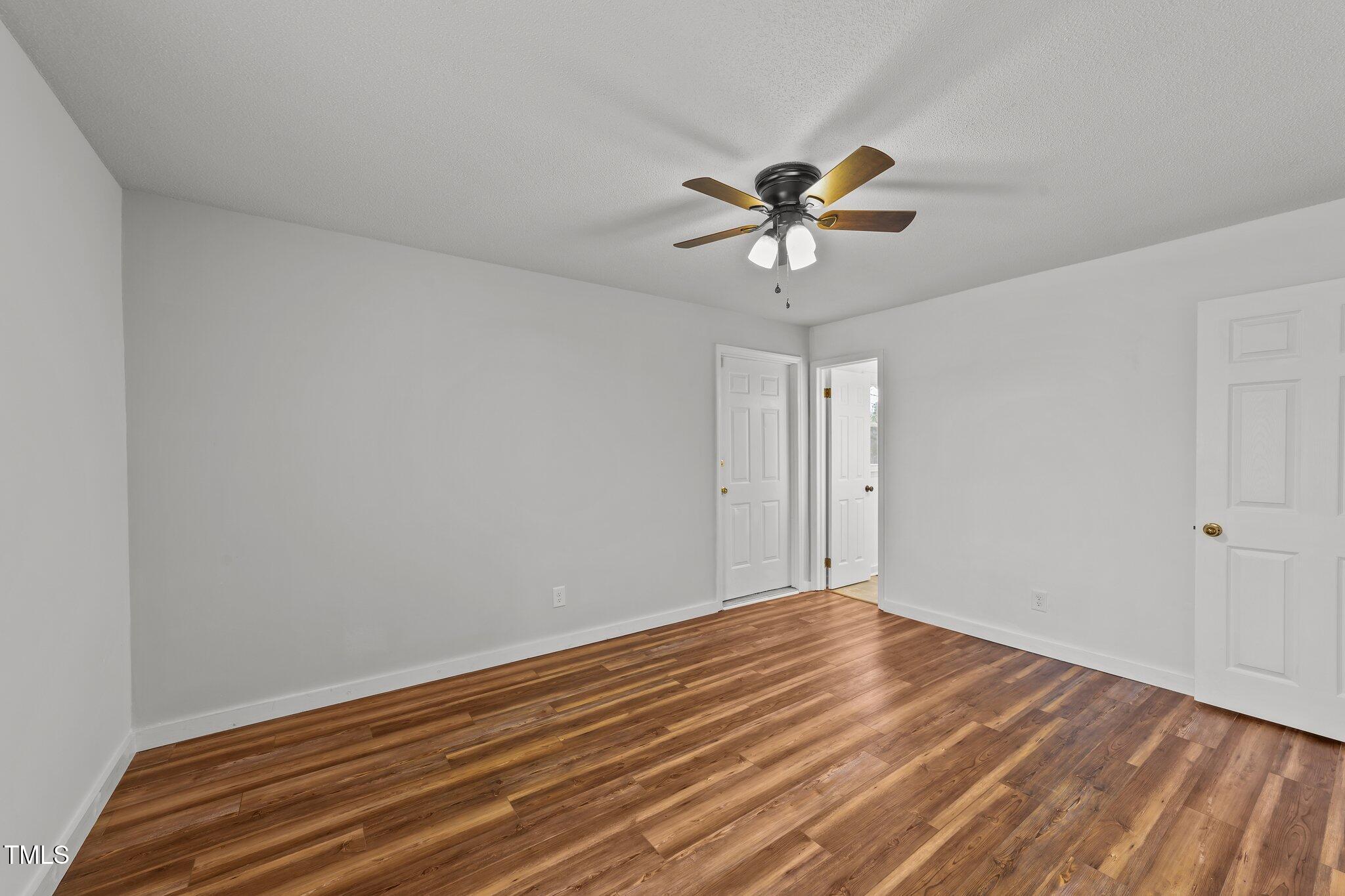 593 Bailey Road Coats, NC 27521 - Photo 24 of 38 a view of room with a ceiling fan and window