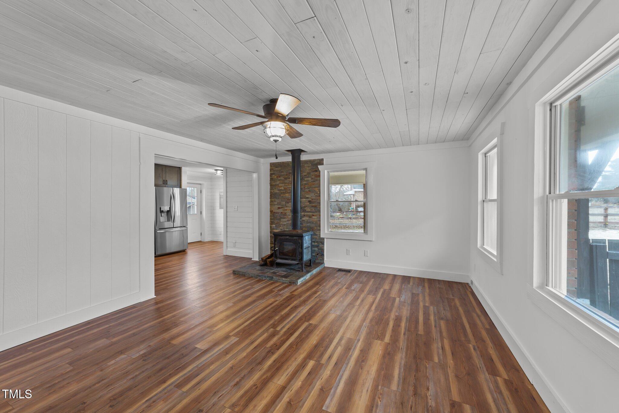 593 Bailey Road Coats, NC 27521 - Photo 5 of 38 a view of an empty room with wooden floor and a window