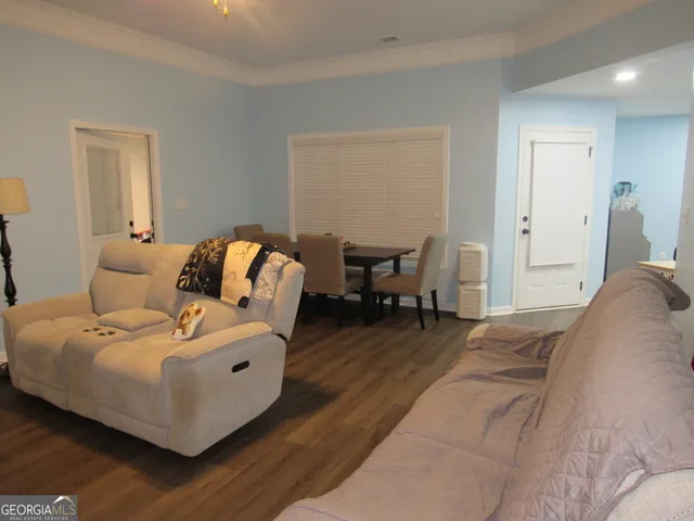 a bedroom with a bed and a lounge chair