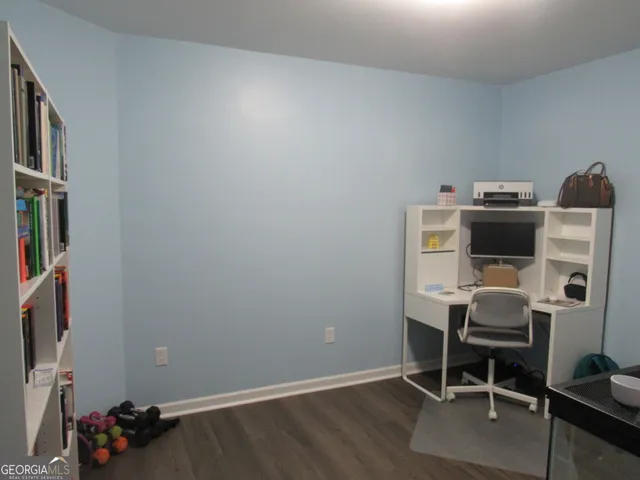 a room with furniture and a book shelf