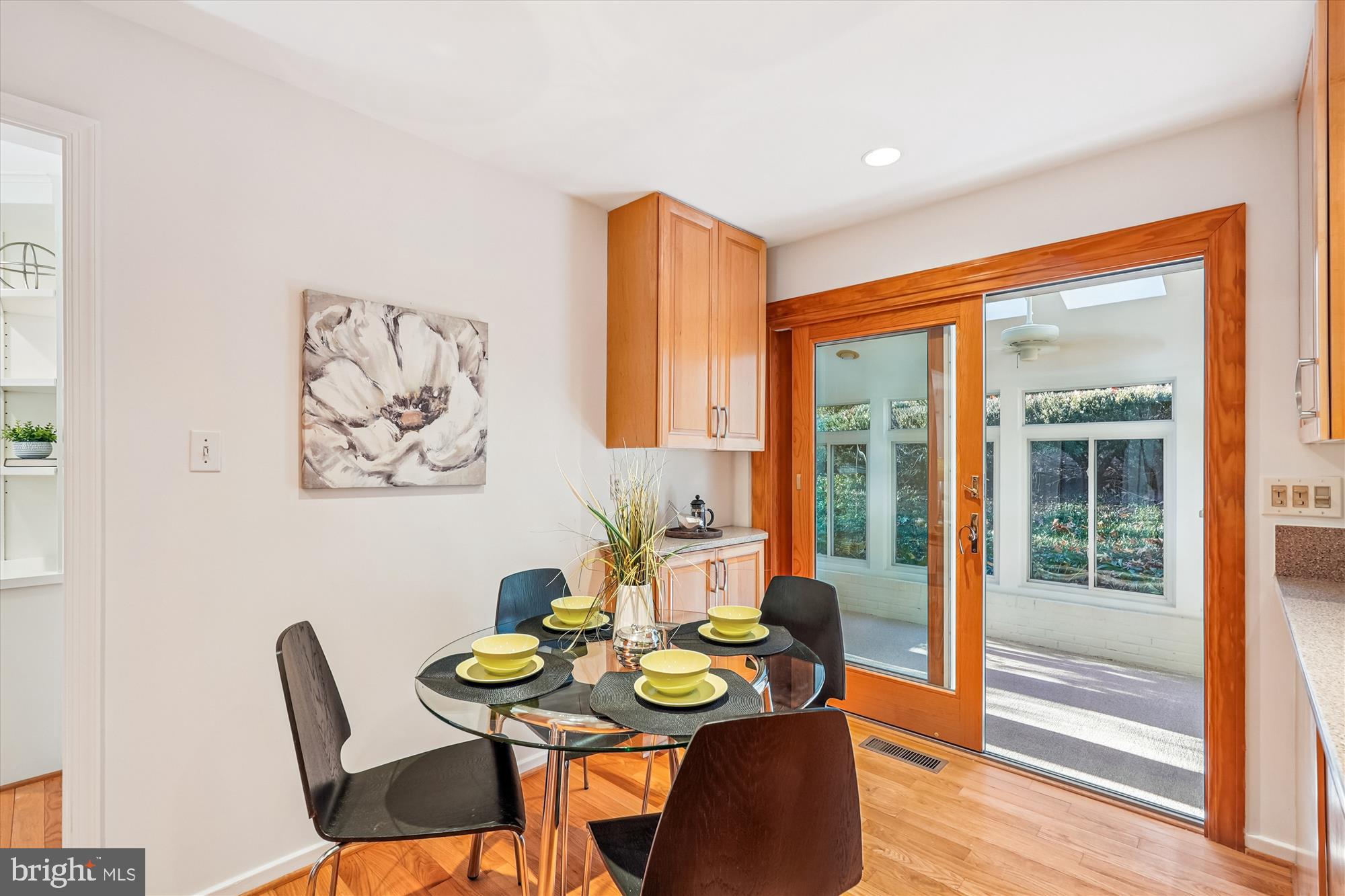 11410 Running Cedar Road Reston, VA 20191 - Photo 17 of 56 a view of a dining room with furniture and wooden floor