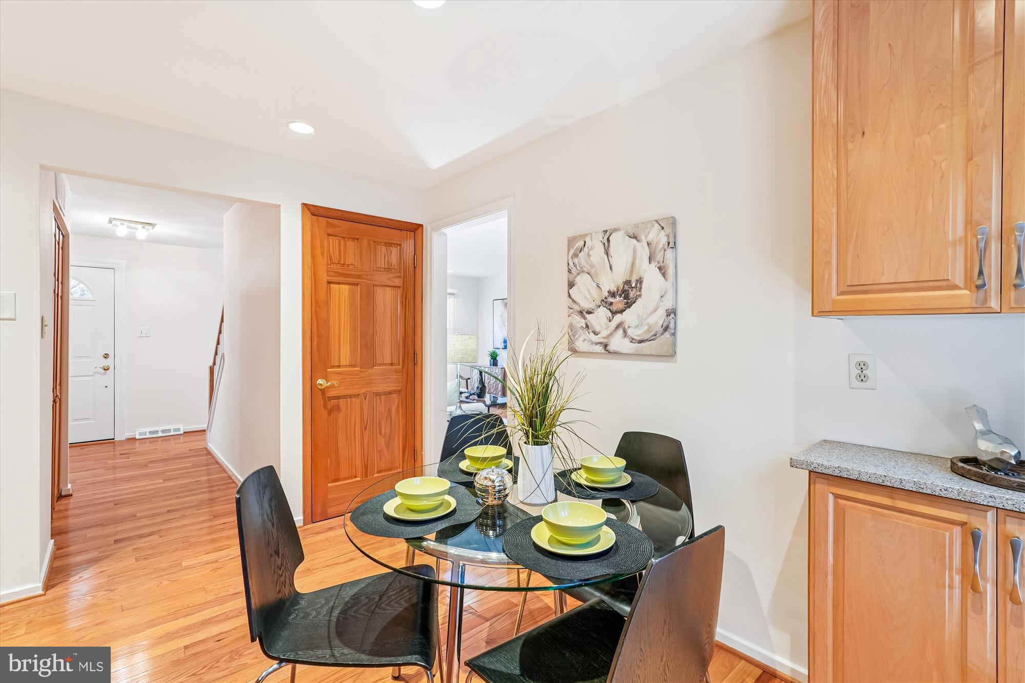11410 Running Cedar Road Reston, VA 20191 - Photo 19 of 56 a view of a dining room with furniture and wooden floor