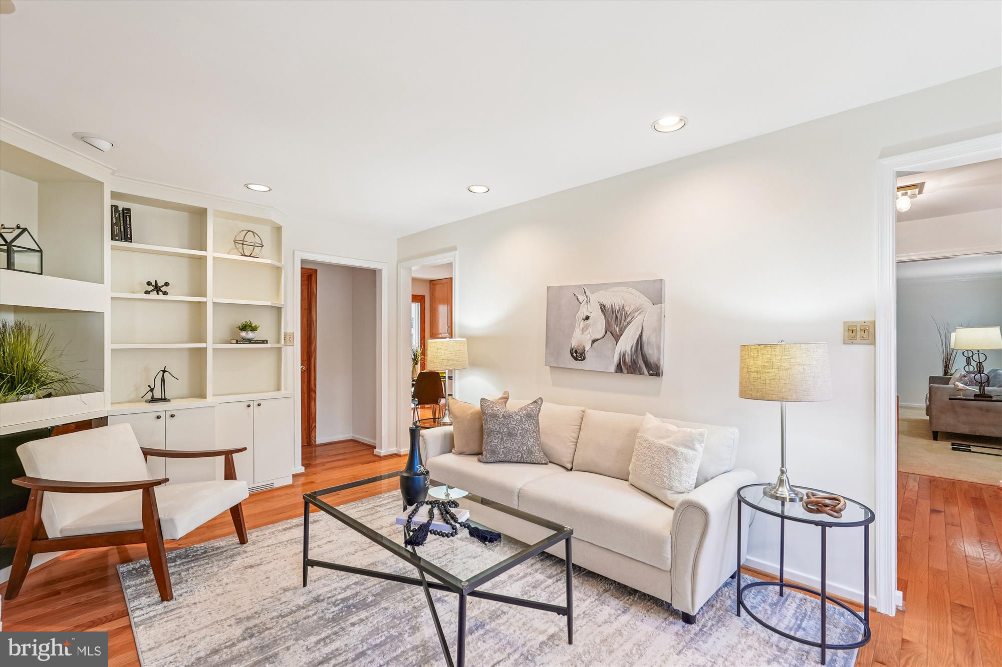 11410 Running Cedar Road Reston, VA 20191 - Photo 22 of 56 a living room with furniture and a painting on the wall