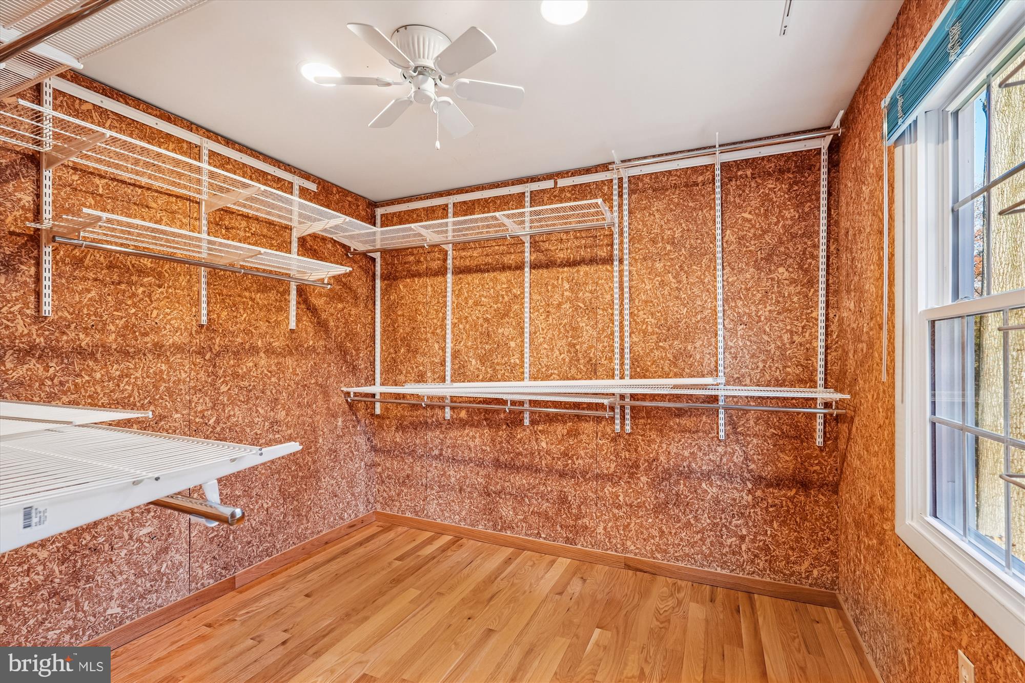 11410 Running Cedar Road Reston, VA 20191 - Photo 29 of 56 a view of an empty room with a window and wooden floor