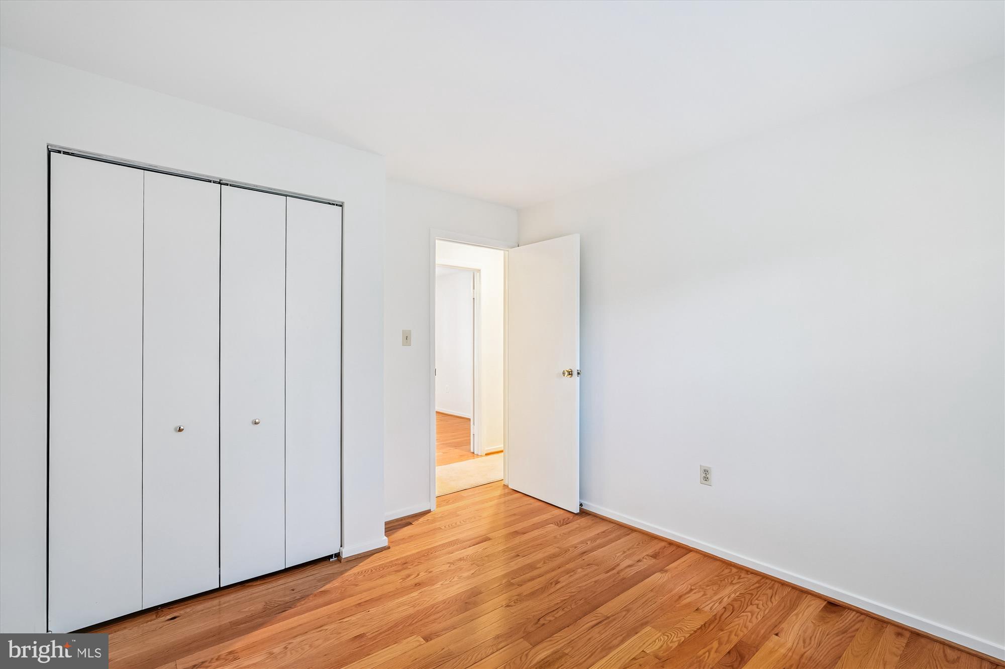 11410 Running Cedar Road Reston, VA 20191 - Photo 36 of 56 a view of an empty room with wooden floor