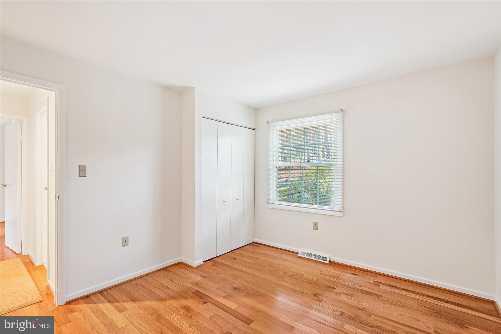 11410 Running Cedar Road Reston, VA 20191 - Photo 39 of 56 a view of an empty room with wooden floor and a window