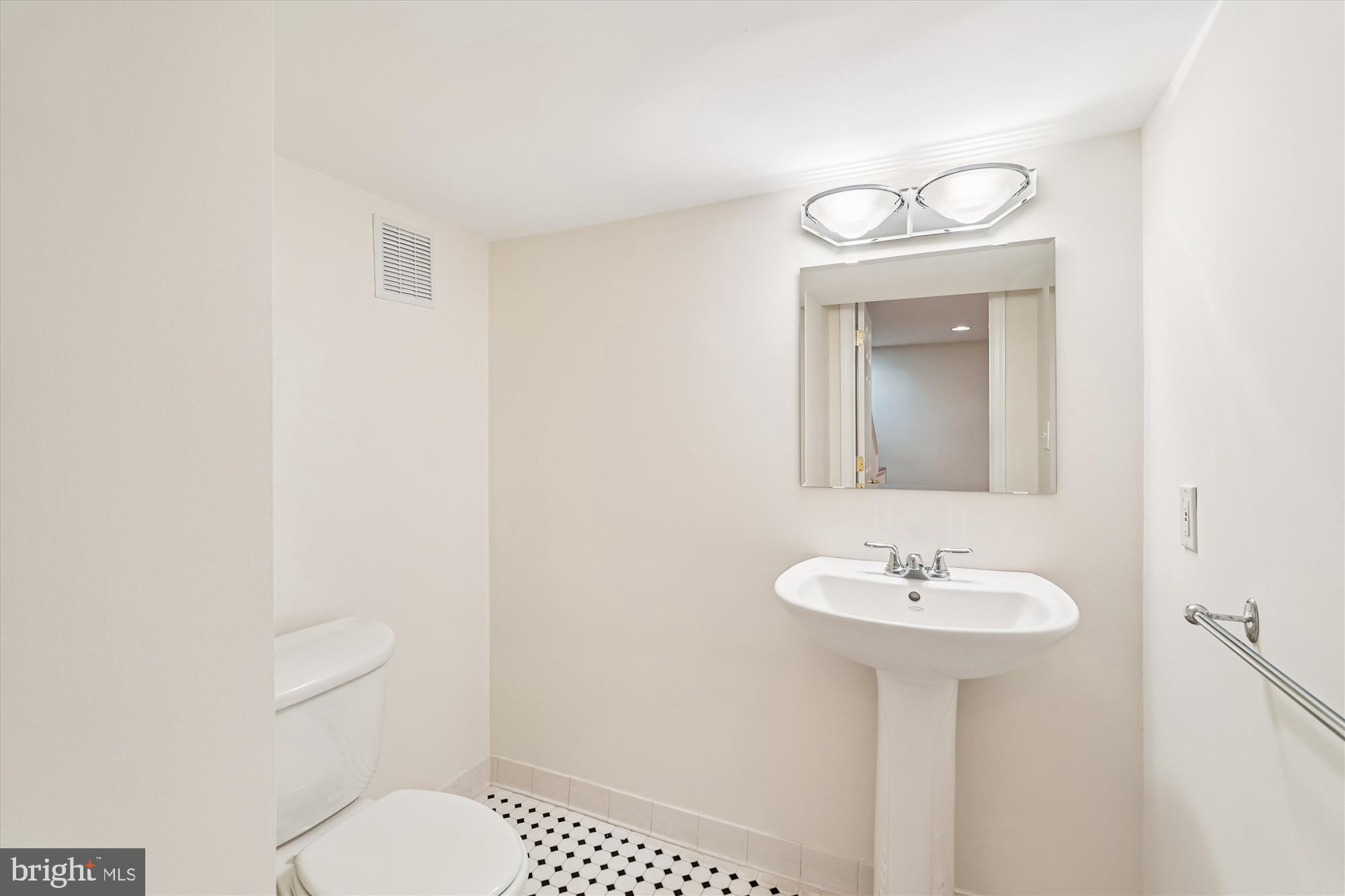11410 Running Cedar Road Reston, VA 20191 - Photo 47 of 56 a bathroom with a toilet sink and mirror