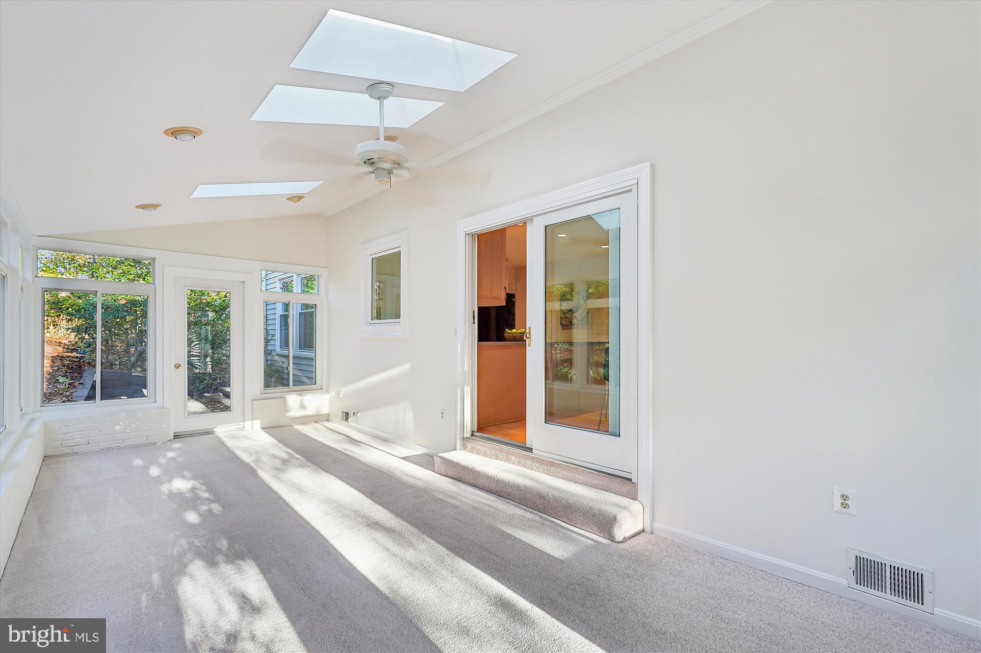 11410 Running Cedar Road Reston, VA 20191 - Photo 49 of 56 a view of a livingroom with a ceiling fan and window