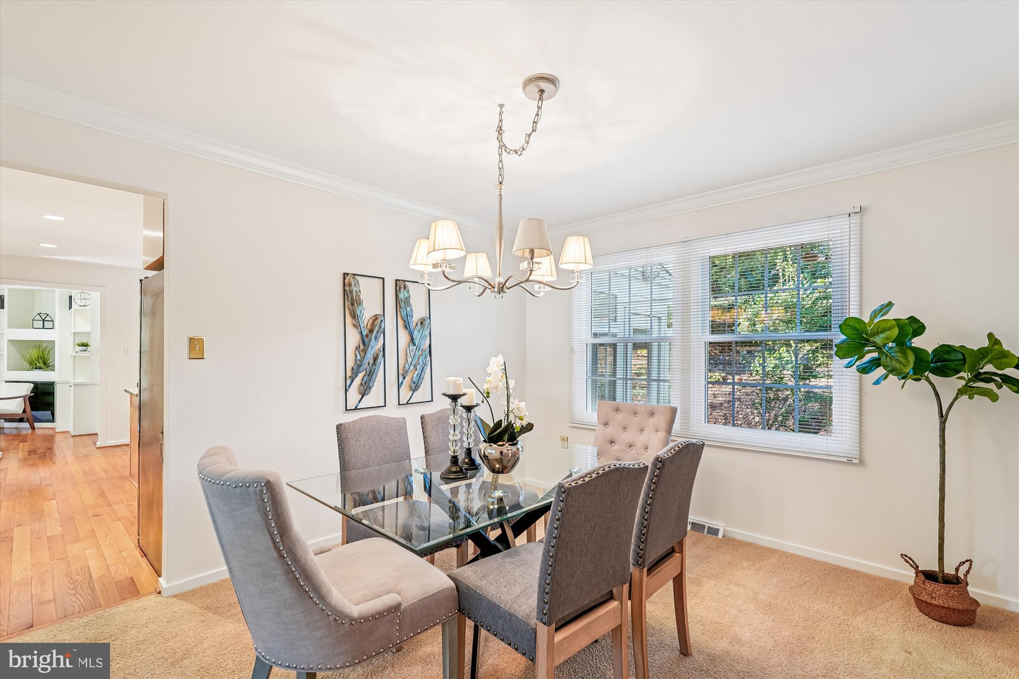 11410 Running Cedar Road Reston, VA 20191 - Photo 10 of 56 a dining room with furniture a chandelier and window