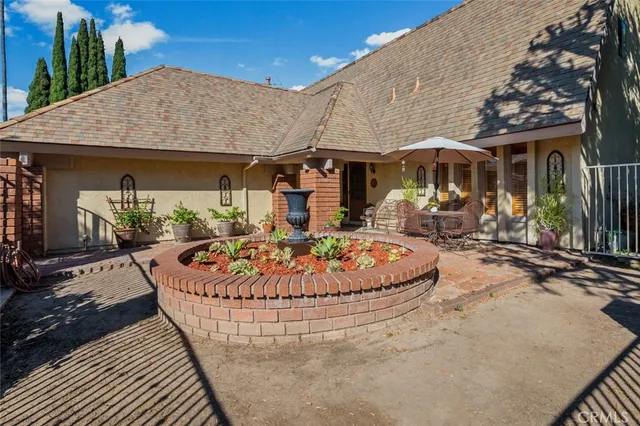 an outdoor space with pool and furniture