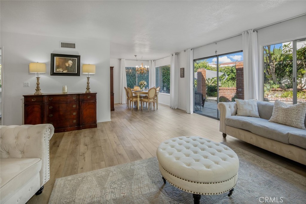 15232 Lille Circle Irvine, CA 92604 - Photo 16 of 54 a living room with furniture and a fireplace