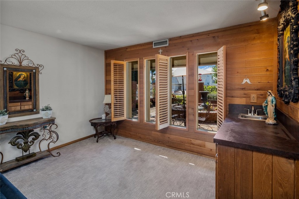 15232 Lille Circle Irvine, CA 92604 - Photo 27 of 54 a living room with furniture and large windows