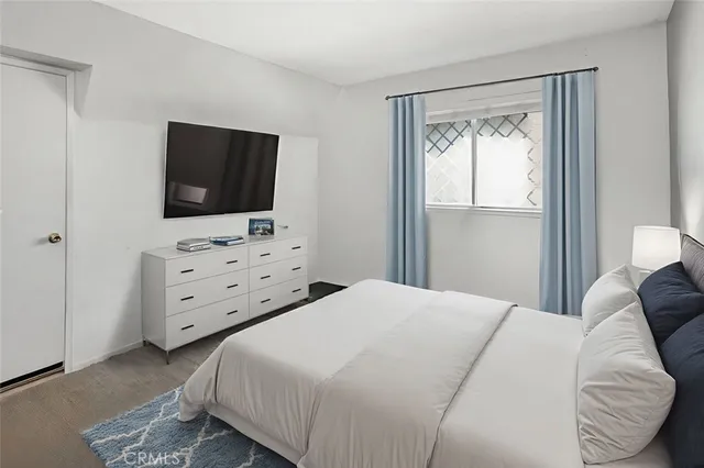 a view of a house with a yard and potted plants