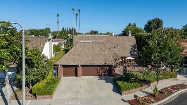a aerial view of a house with palm trees