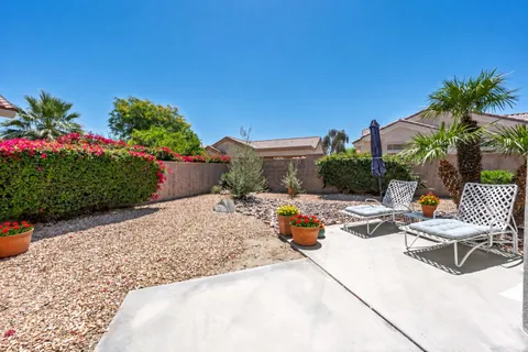 a view of a backyard patio and swimming pool