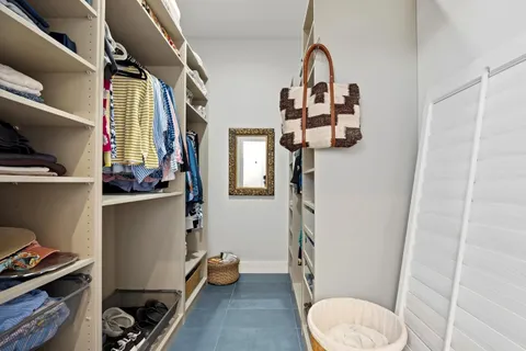 a bathroom with a toilet and a mirror