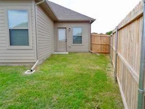 a view of a backyard of the house