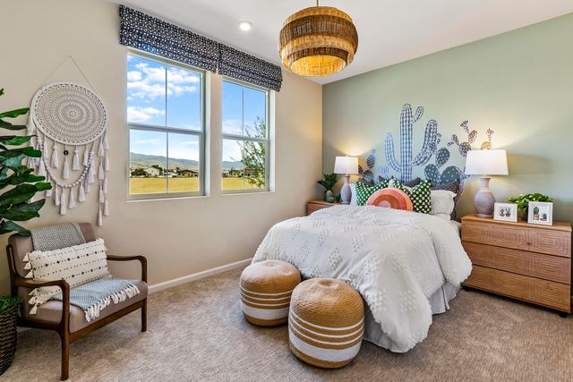 a bedroom with bed and window
