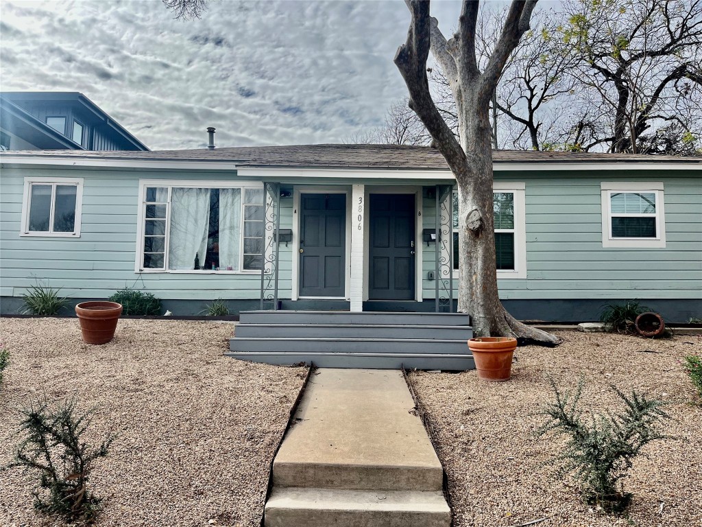 3806 Ridgelea Drive, Unit B Austin, TX 78731 - Photo 1 of 17 a front view of a house with a yard