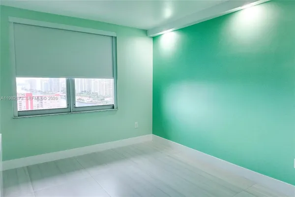 a view of a room that has a window