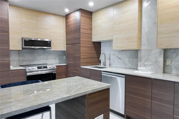 a kitchen with a stove and a sink