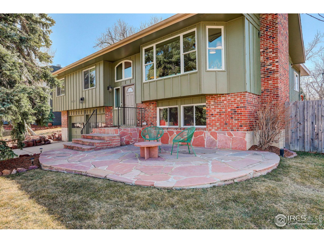 a view of a house with backyard porch and sitting area