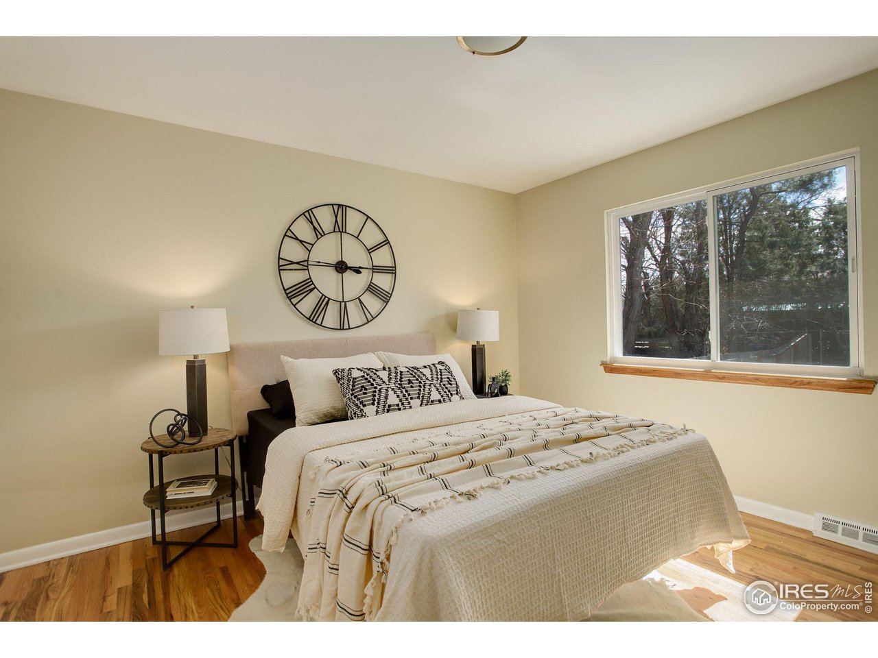 4361 Butler Circle Boulder, CO 80305 - Photo 16 of 39 a bedroom with a bed and a large window