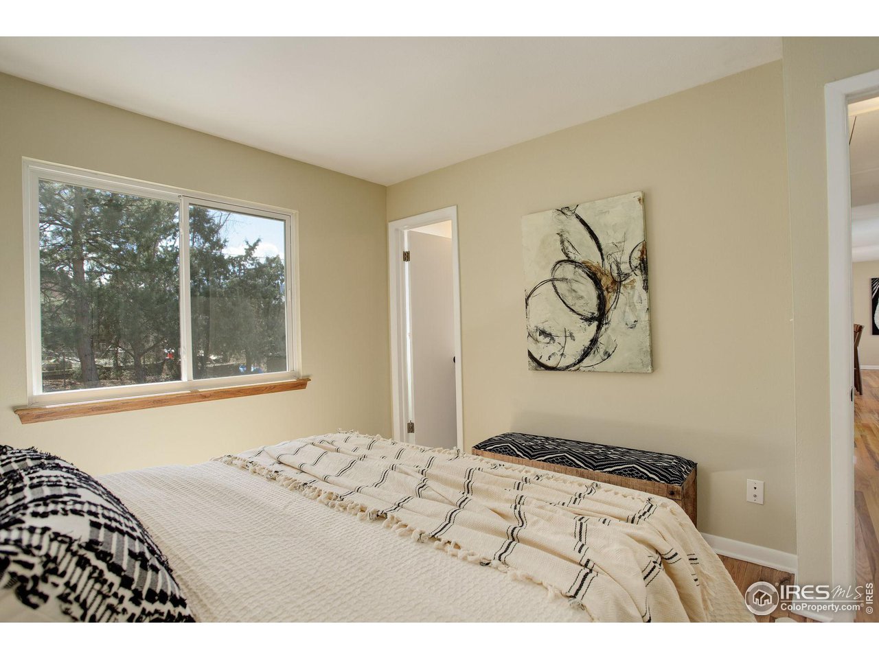 4361 Butler Circle Boulder, CO 80305 - Photo 18 of 39 a bedroom with a bed and a window