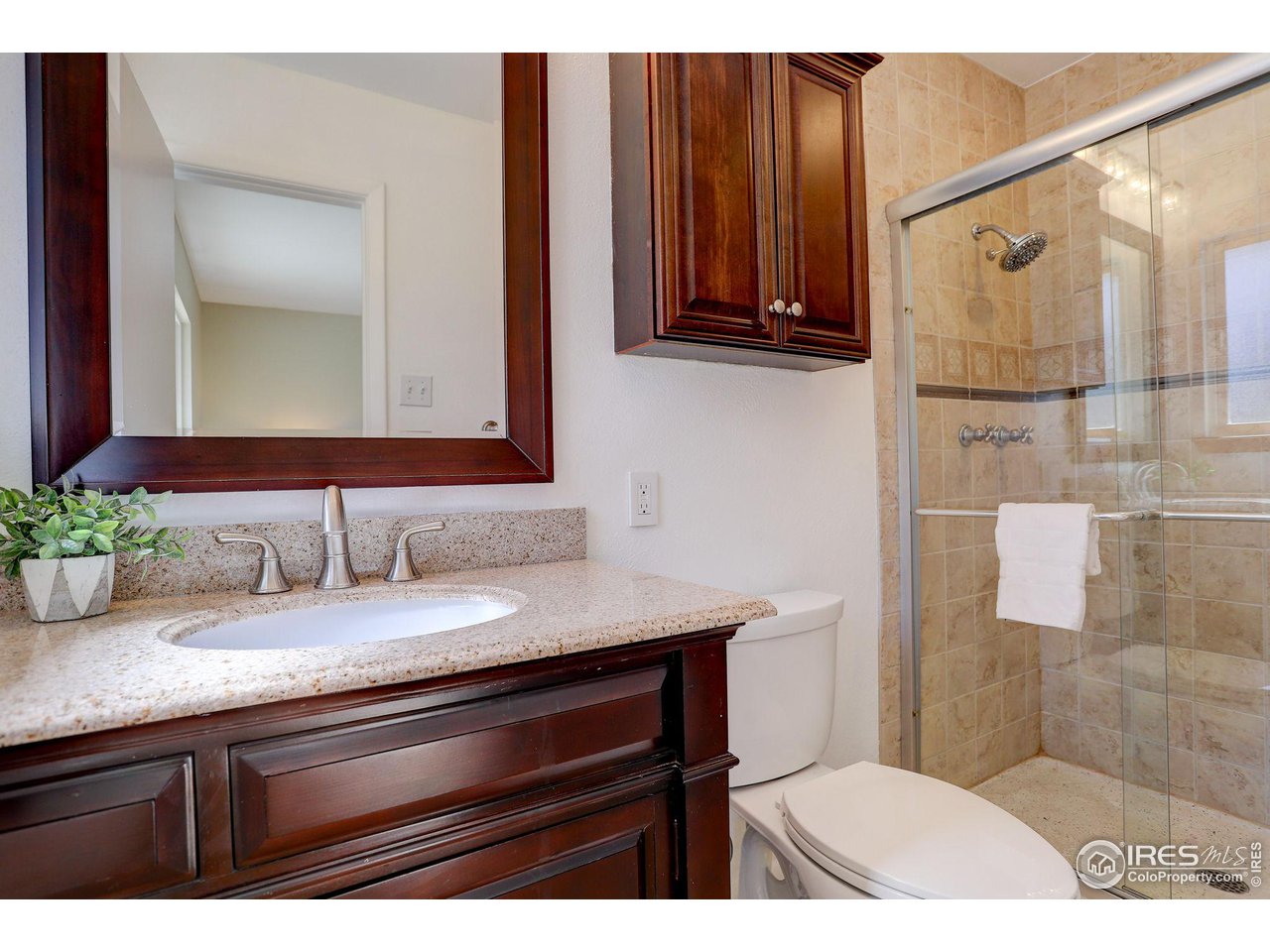4361 Butler Circle Boulder, CO 80305 - Photo 19 of 39 a bathroom with a sink and a mirror