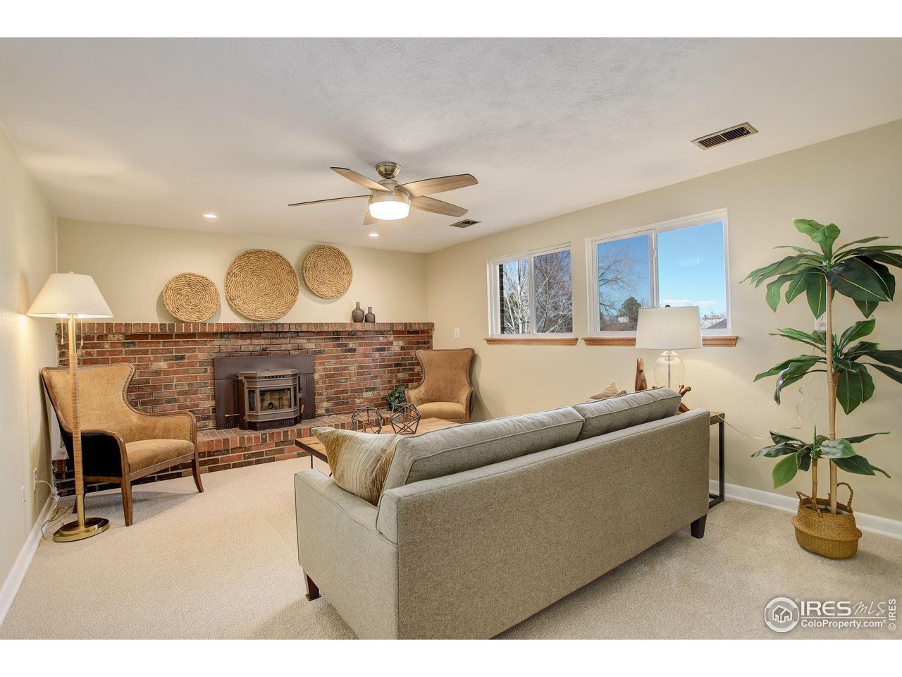 4361 Butler Circle Boulder, CO 80305 - Photo 23 of 39 a living room with furniture and a fireplace