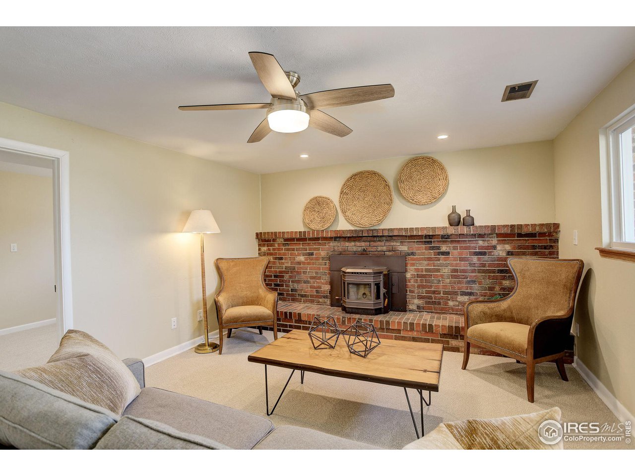 4361 Butler Circle Boulder, CO 80305 - Photo 24 of 39 a living room with furniture a rug and a ceiling fan