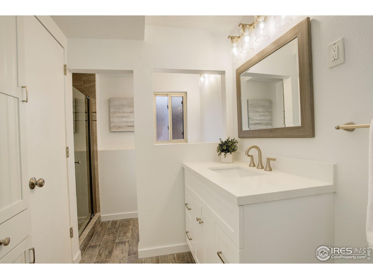 4361 Butler Circle Boulder, CO 80305 - Photo 28 of 39 a bathroom with a sink and a mirror