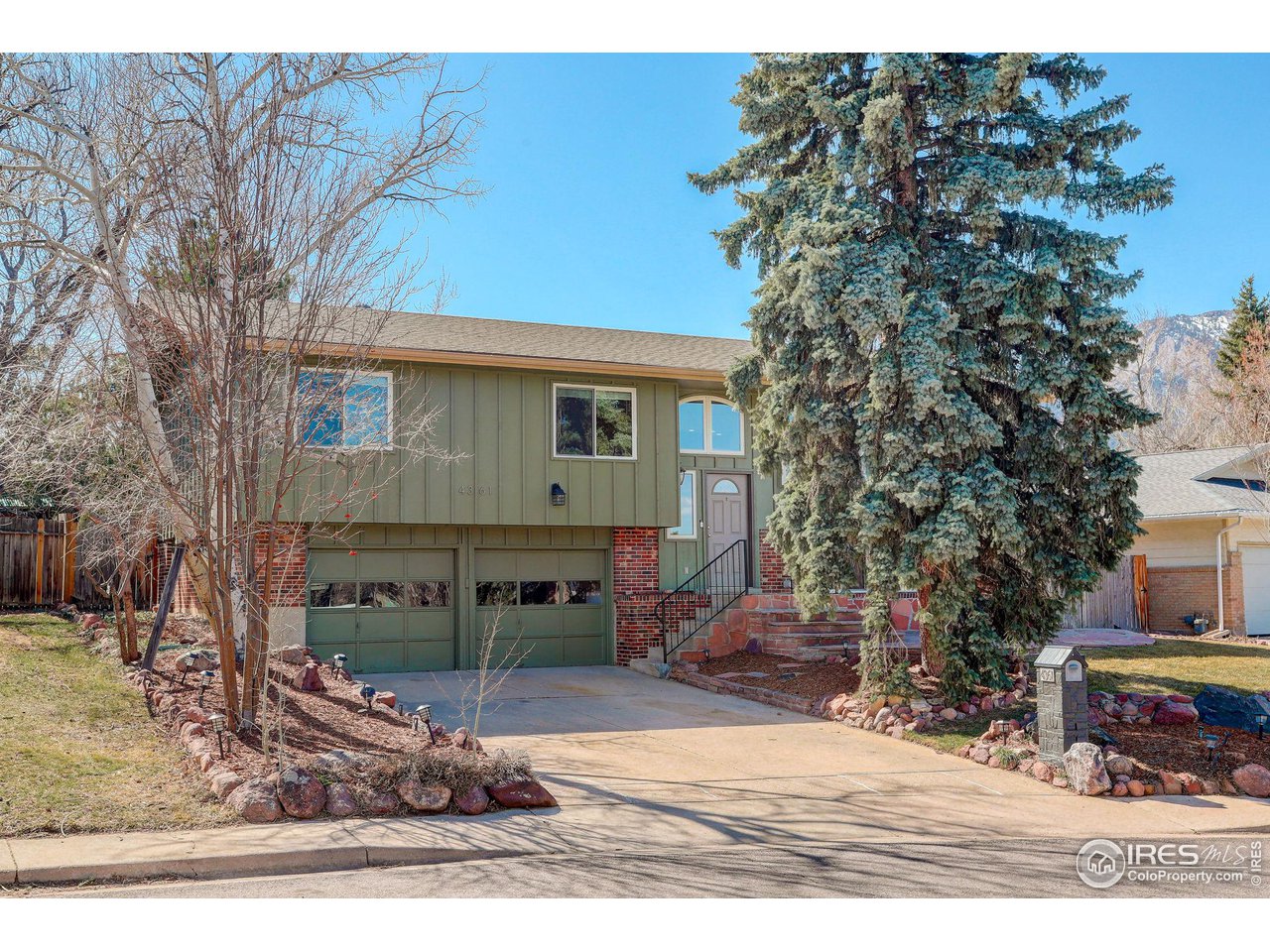 4361 Butler Circle Boulder, CO 80305 - Photo 3 of 39 a front view of a house with a yard