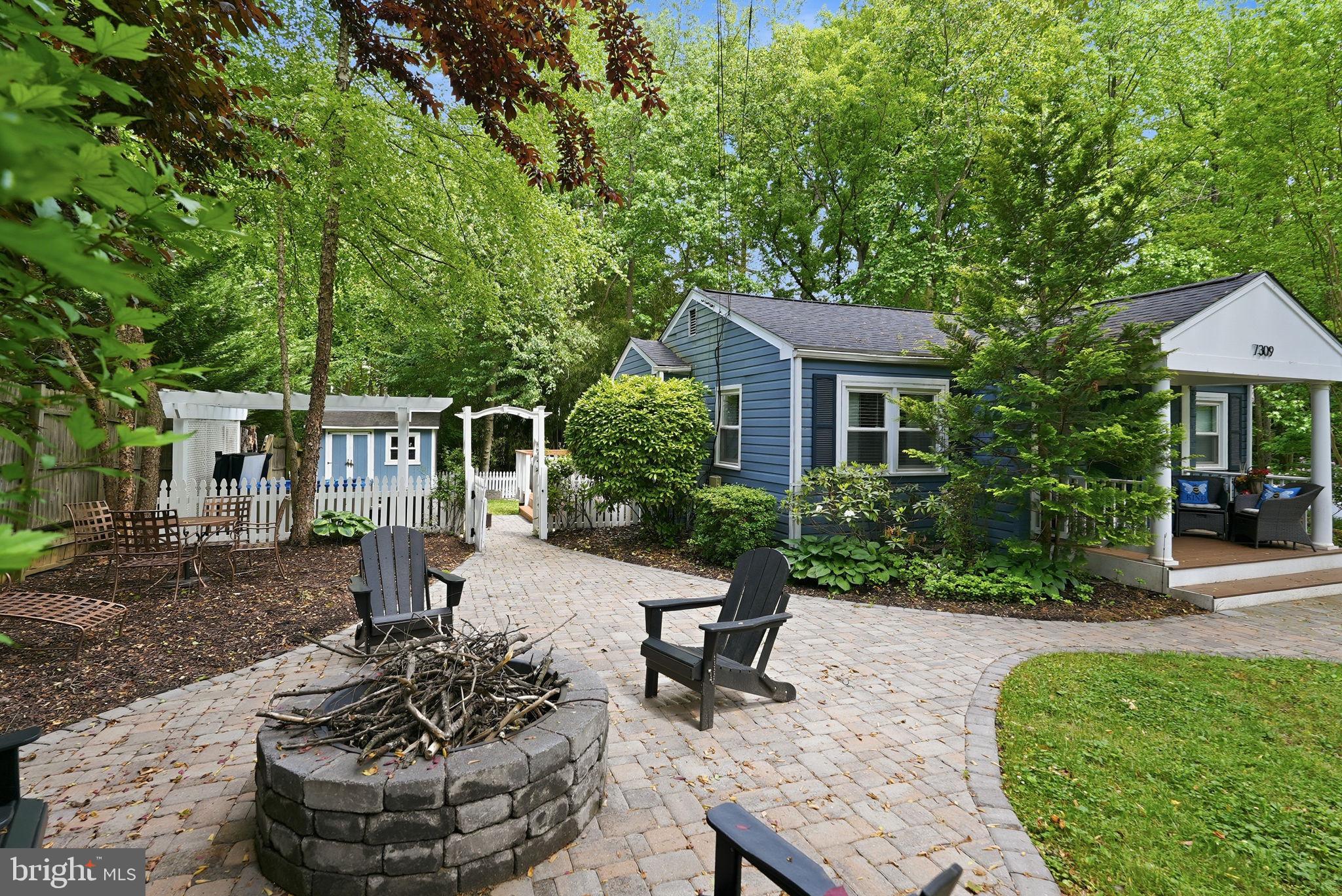 7309 Neuman Street Springfield, VA 22150 - Photo 4 of 33 fire pit area with paver patio