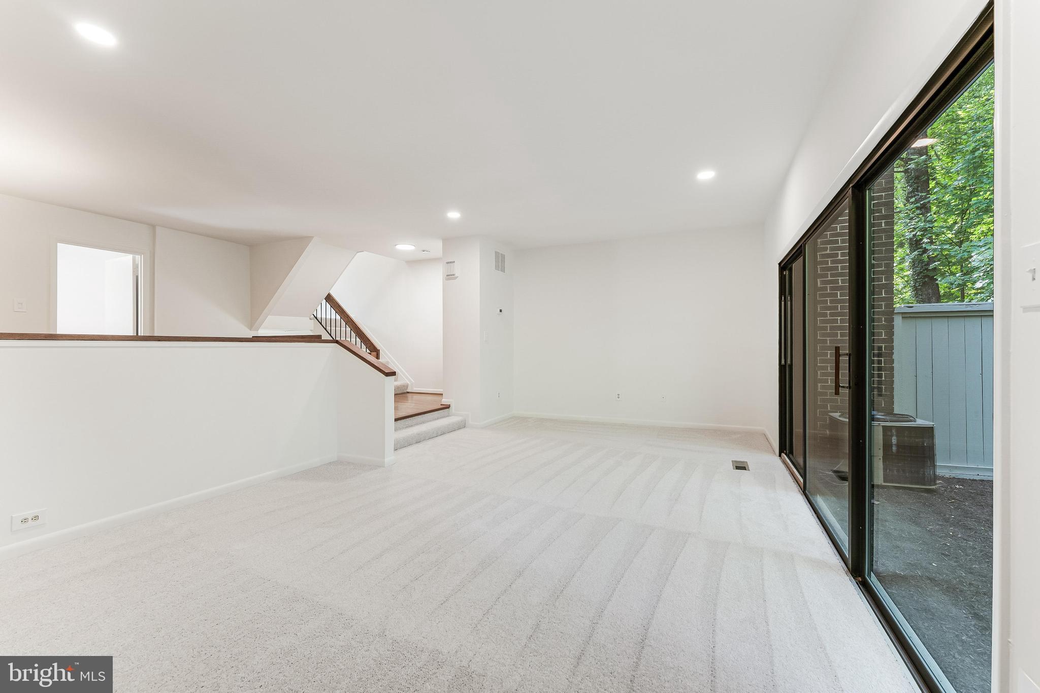 12023 Insha Court Reston, VA 20191 - Photo 29 of 52 a view of an empty room with stairs
