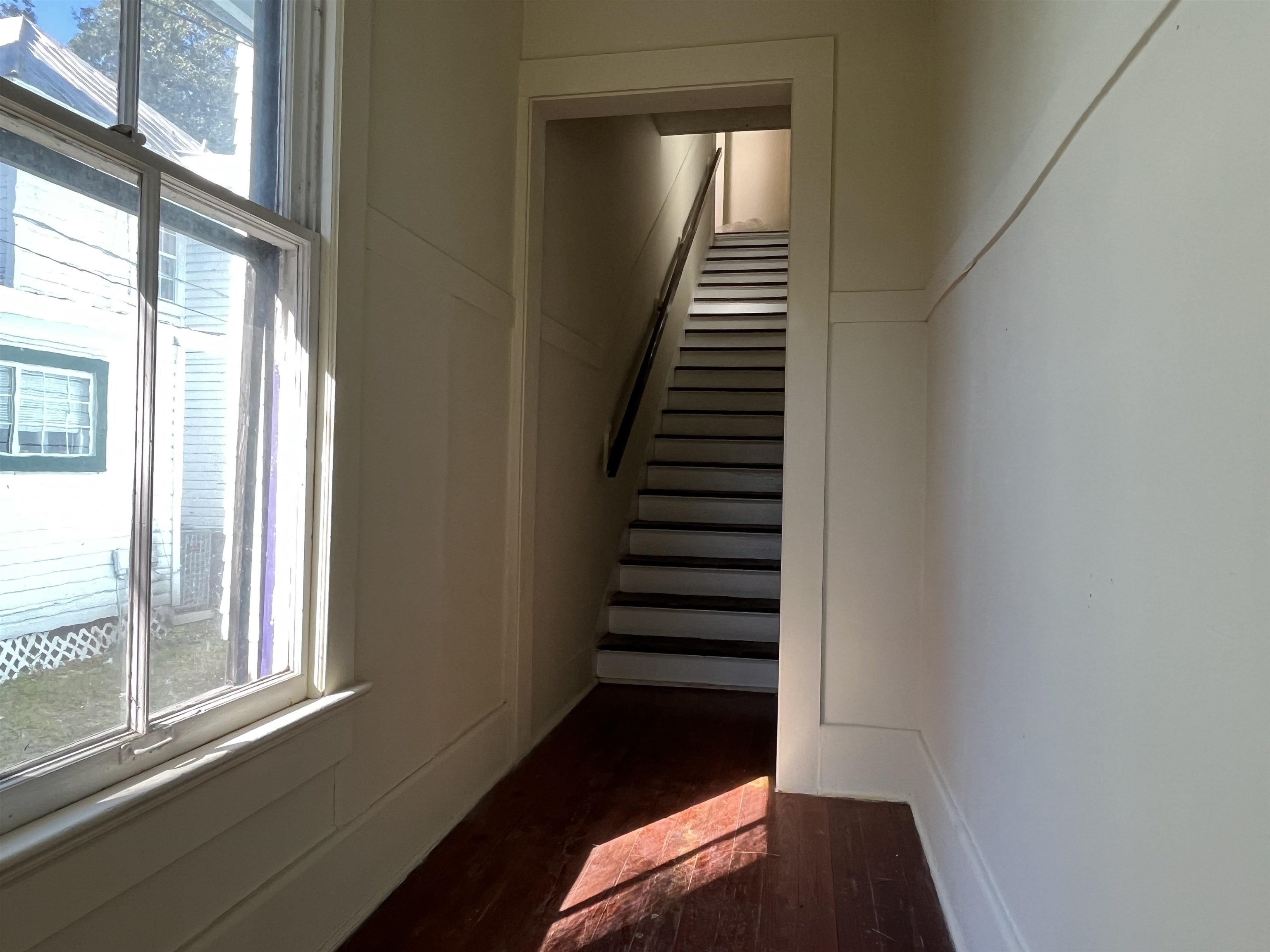 114 Bridge Street, Unit B St. Augustine, FL 32084 - Photo 14 of 14 a view of a hallway with windows