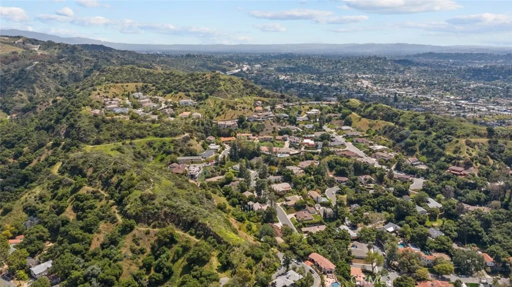 0 Edwards Place Glendale, CA 91206 - Photo 9 of 16 an aerial view of residential house with green space and fog
