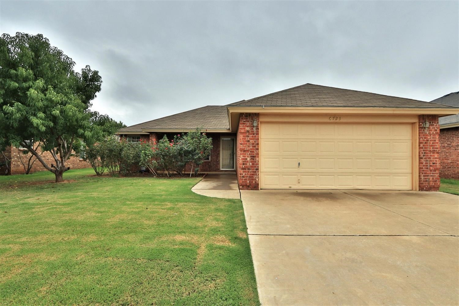 6723 8th Street Lubbock, TX 79416 - Photo 1 of 9 a front view of house with yard