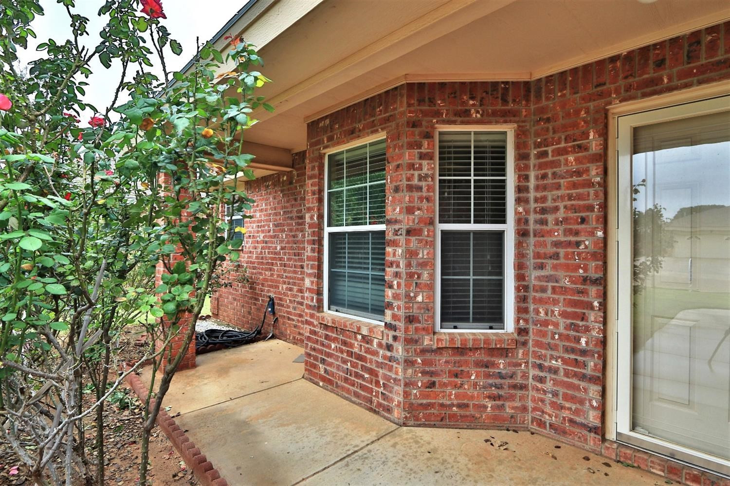 6723 8th Street Lubbock, TX 79416 - Photo 4 of 9 a front view of a house with large windows