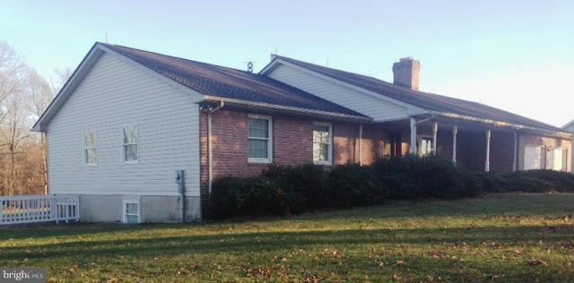 11833 Cash Smith Road Keymar, MD 21757 - Photo 1 of 16 a front view of a house with a garden