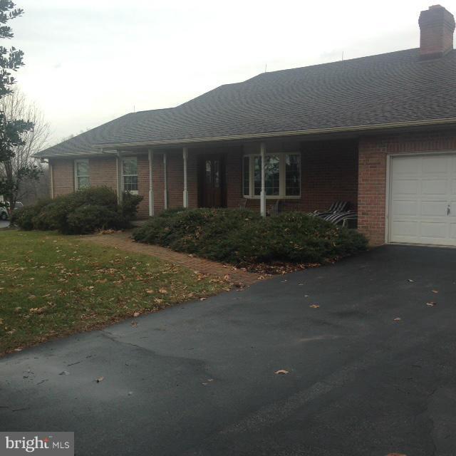 11833 Cash Smith Road Keymar, MD 21757 - Photo 2 of 16 a front view of a house with a yard and garage